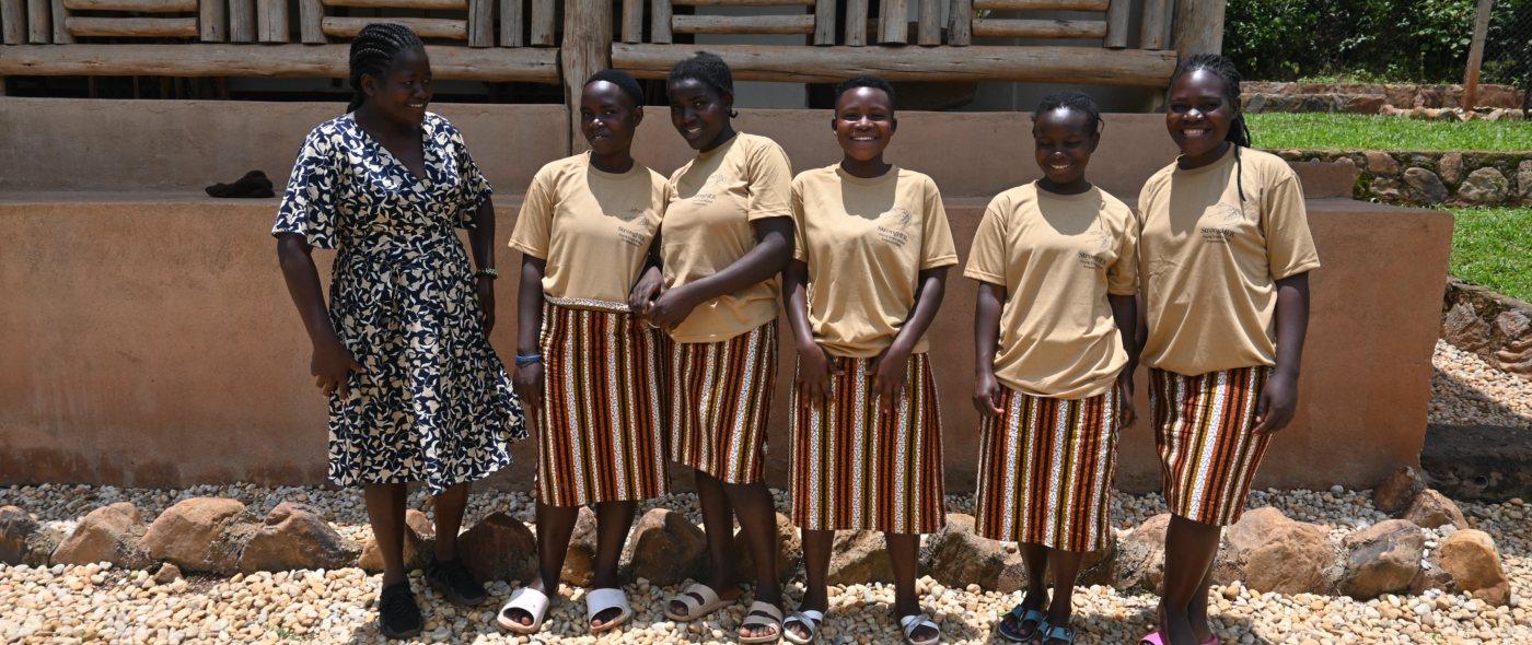 The young women of StrongHER Uganda outside their workshop in Bwindi
